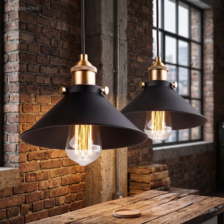 Pair of cone pendants glowing against exposed red brick and timber