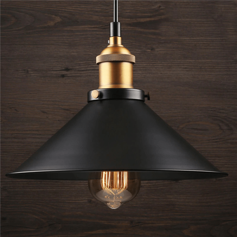 Single black cone pendant with an exposed bulb against dark timber