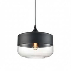 Clear glass drum shade with a black metal cap on white