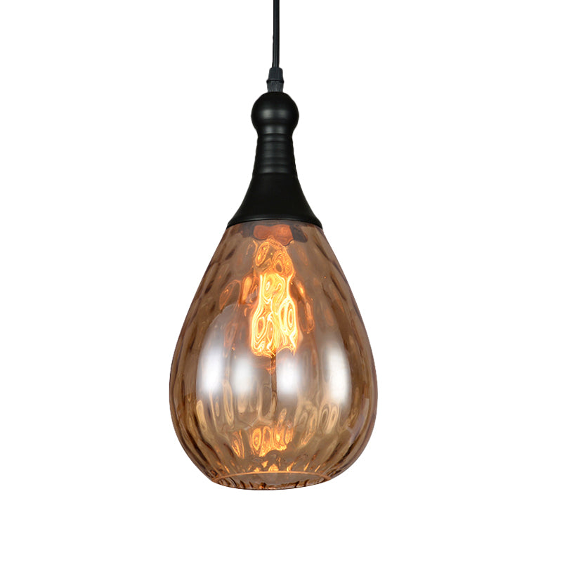 Black capped teardrop pendant with an amber dimpled glass shade