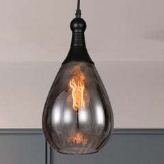 Smoke teardrop pendant lit against a grey and white painted corner