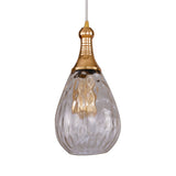 Brass capped teardrop pendant with a clear dimpled glass shade