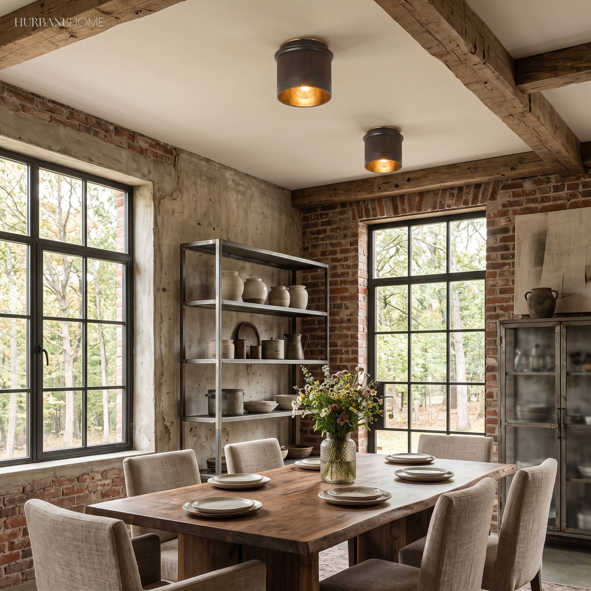 Two industrial flush mount ceiling lights above a rustic dining table
