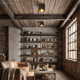 Ribbed metal ceiling lights on a beamed ceiling above a leather sofa