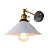 White cone shade sconce with an aged bronze arm and round backplate