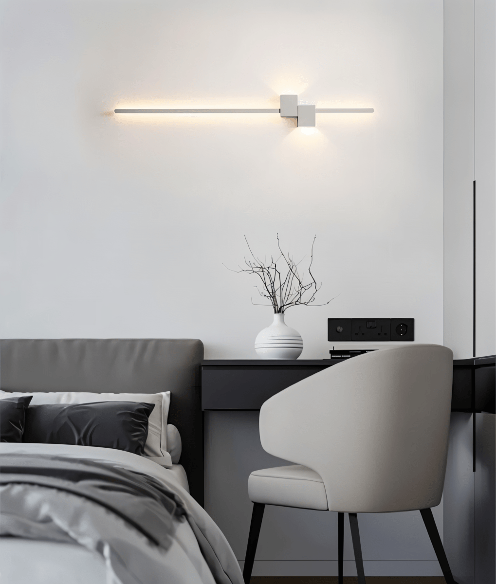Integrated LED wall sconce with seamless bulb free housing