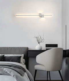 Integrated LED wall sconce with seamless bulb free housing