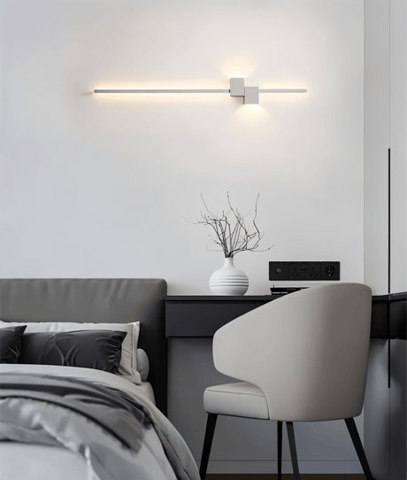 Integrated LED wall sconce with seamless bulb free housing