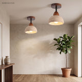 Two travertine dome ceiling lights showing the stone shade over an entryway