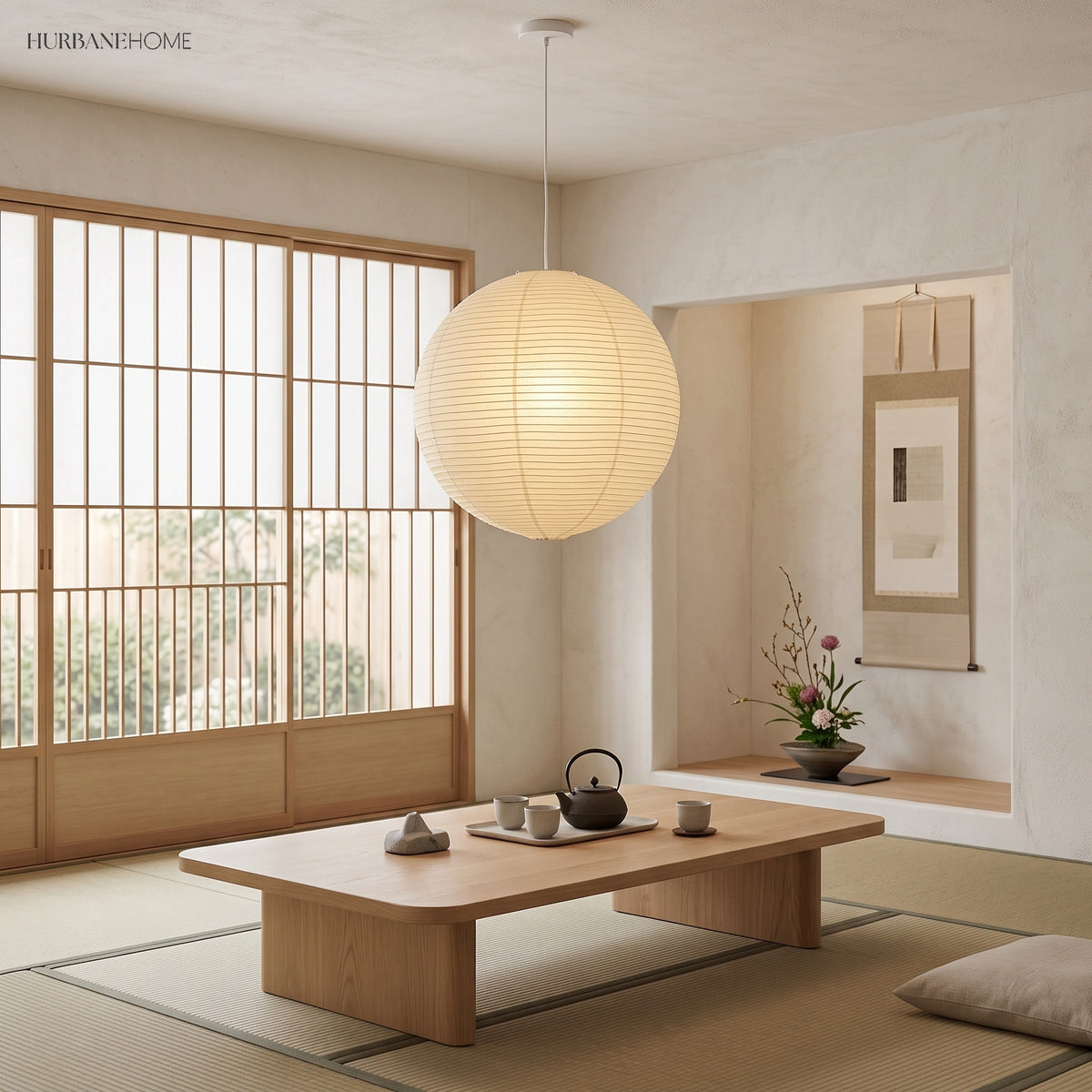 Paper lantern pendant above a low tea table in a tatami room