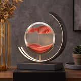 Kinetic sand lamp with curved LED light on styled console table