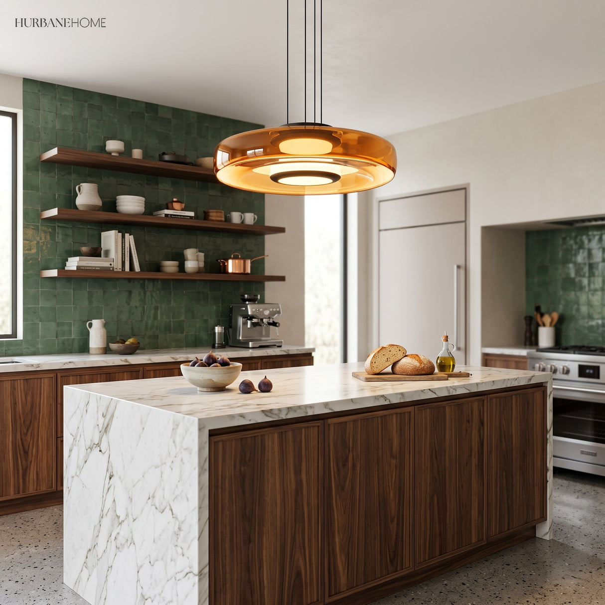 Amber glass disc pendant light over a marble island in a green-cabinet kitchen