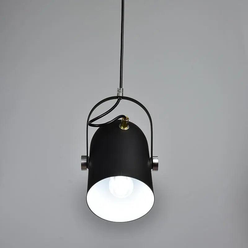 Black spot pendant seen head on with the bulb lit inside