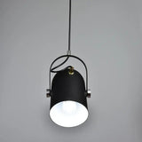 Black spot pendant seen head on with the bulb lit inside