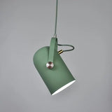Green pendant angled steeply on a matching green cord