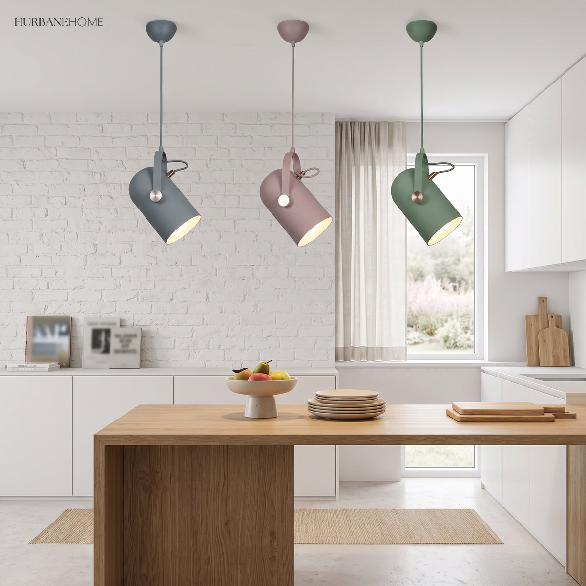 Three coloured spot pendants hung above a pale kitchen island