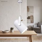 White angled pendant lit above a light wooden dining table
