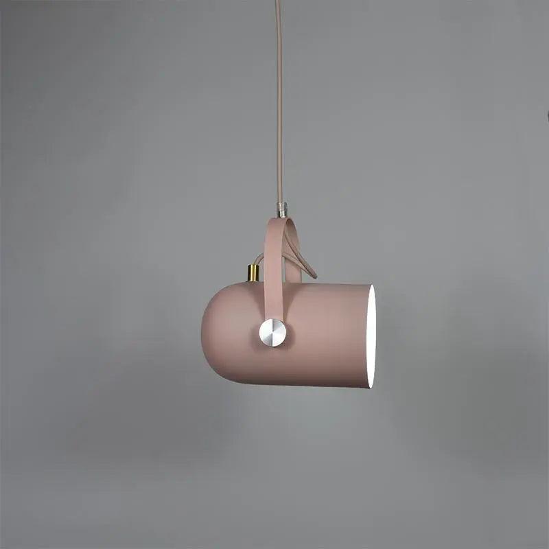Pink spot pendant tilted downward on a pale cord