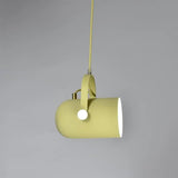 Yellow pendant tilted sideways showing the white inner shade
