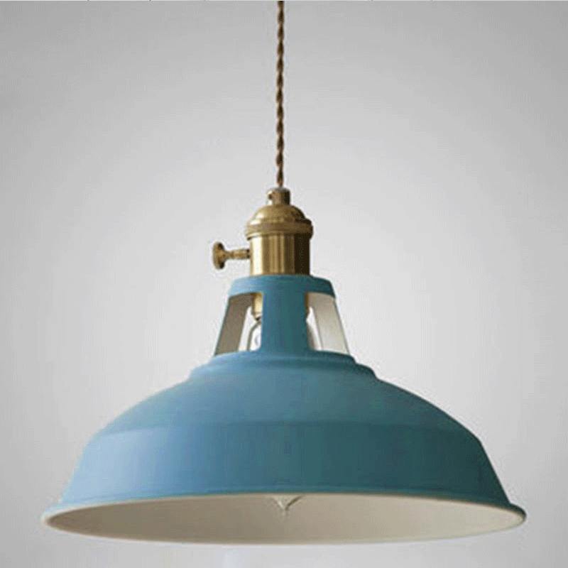 Angled studio view of the blue barn shade and brass socket