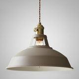 Angled studio view of the khaki barn shade and brass socket