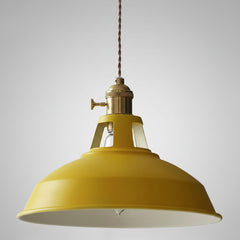 Angled studio view of the yellow barn shade and brass socket