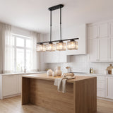 Kitchen island pendant light in black over a timber island in a white kitchen