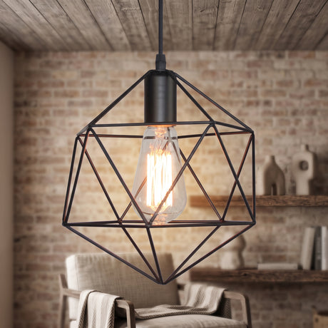 Black cage pendant with a filament bulb against an exposed brick wall