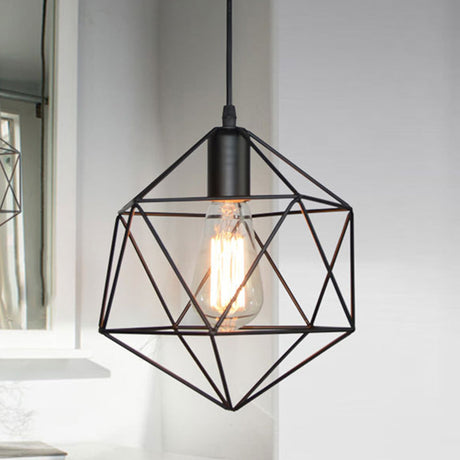 Black cage pendant hanging beside a bright window in a white room