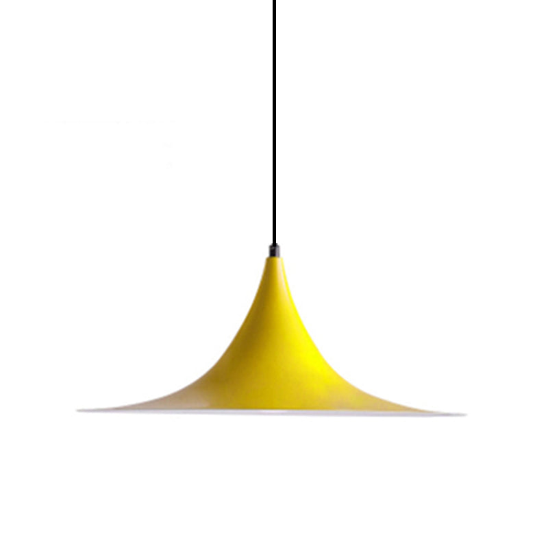 Yellow flared metal pendant shade on a cord, shown against white