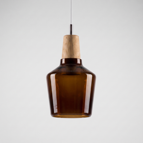 Tall amber glass bell shade with a wood top on a grey background