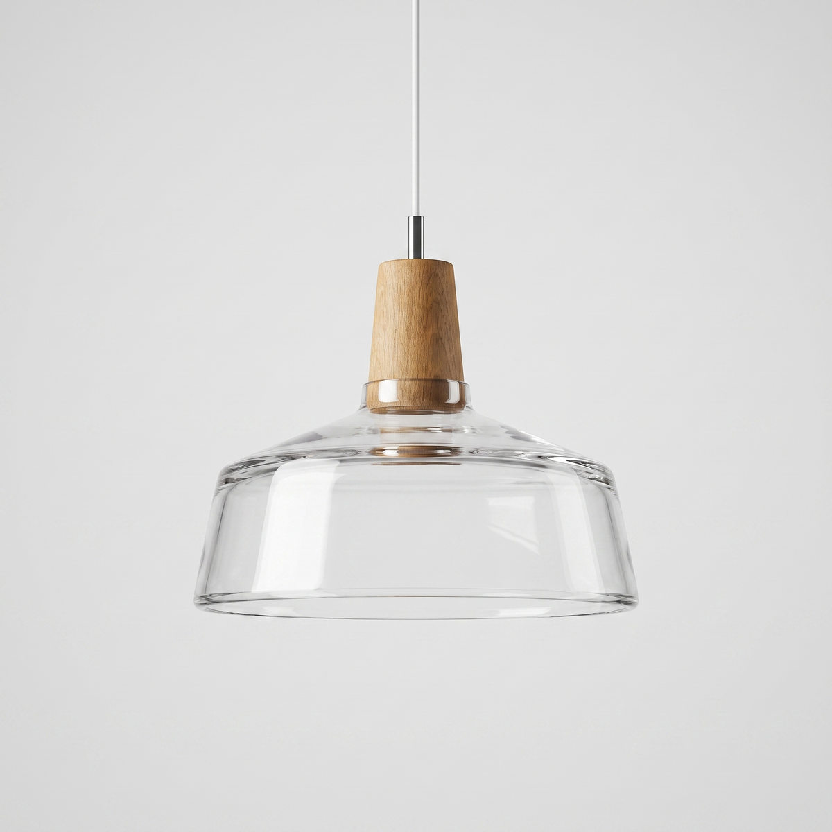 Clear glass bowl shade flaring out below a natural wood top