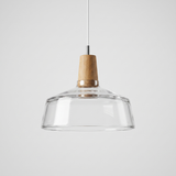 Clear glass bowl shade flaring out below a natural wood top