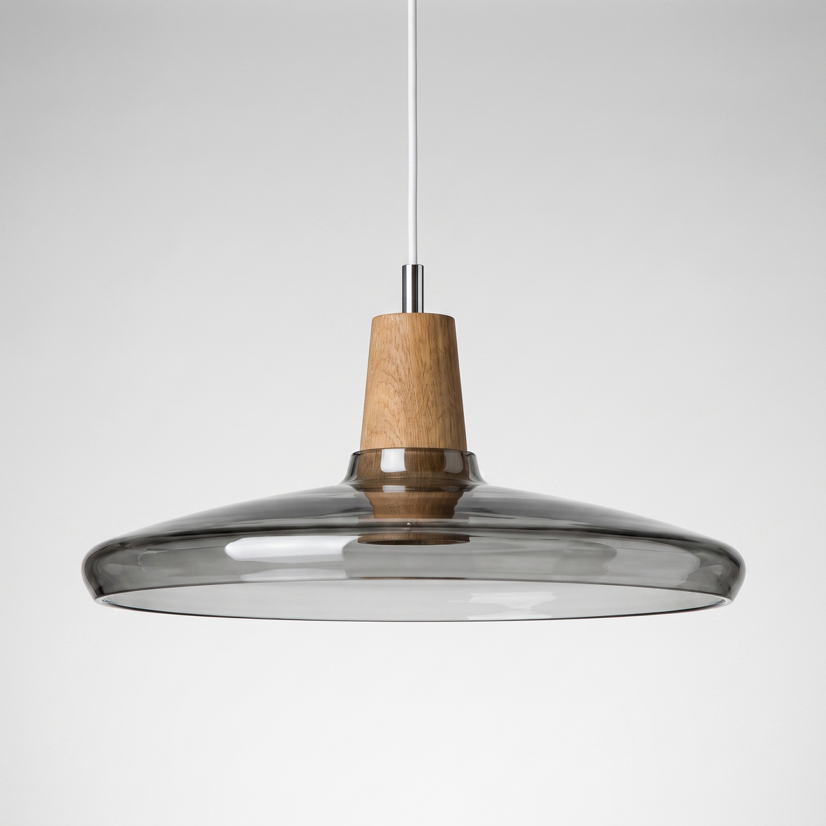 Wide grey smoke glass saucer shade with a wood top