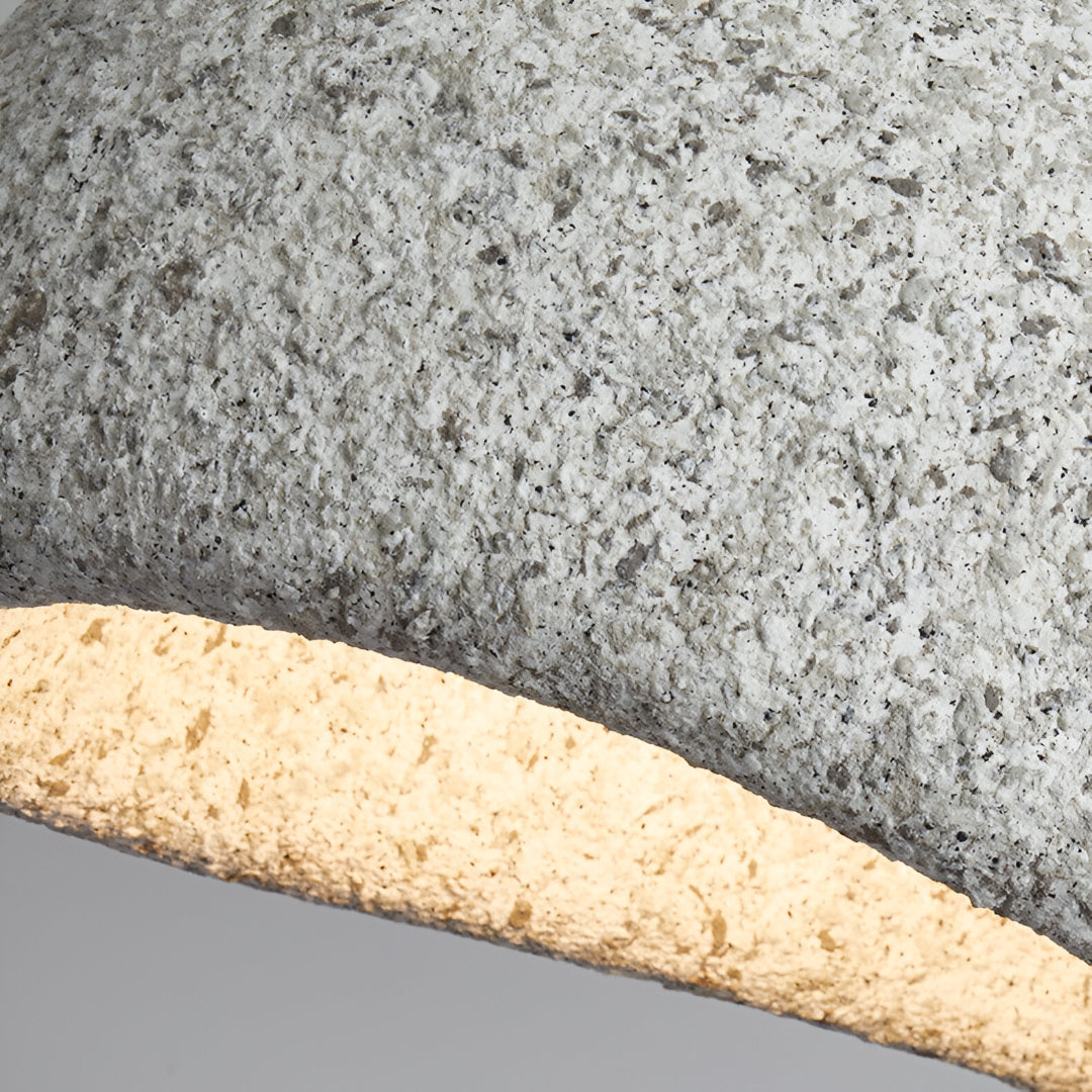 Close view of the speckled grey shade surface under warm light