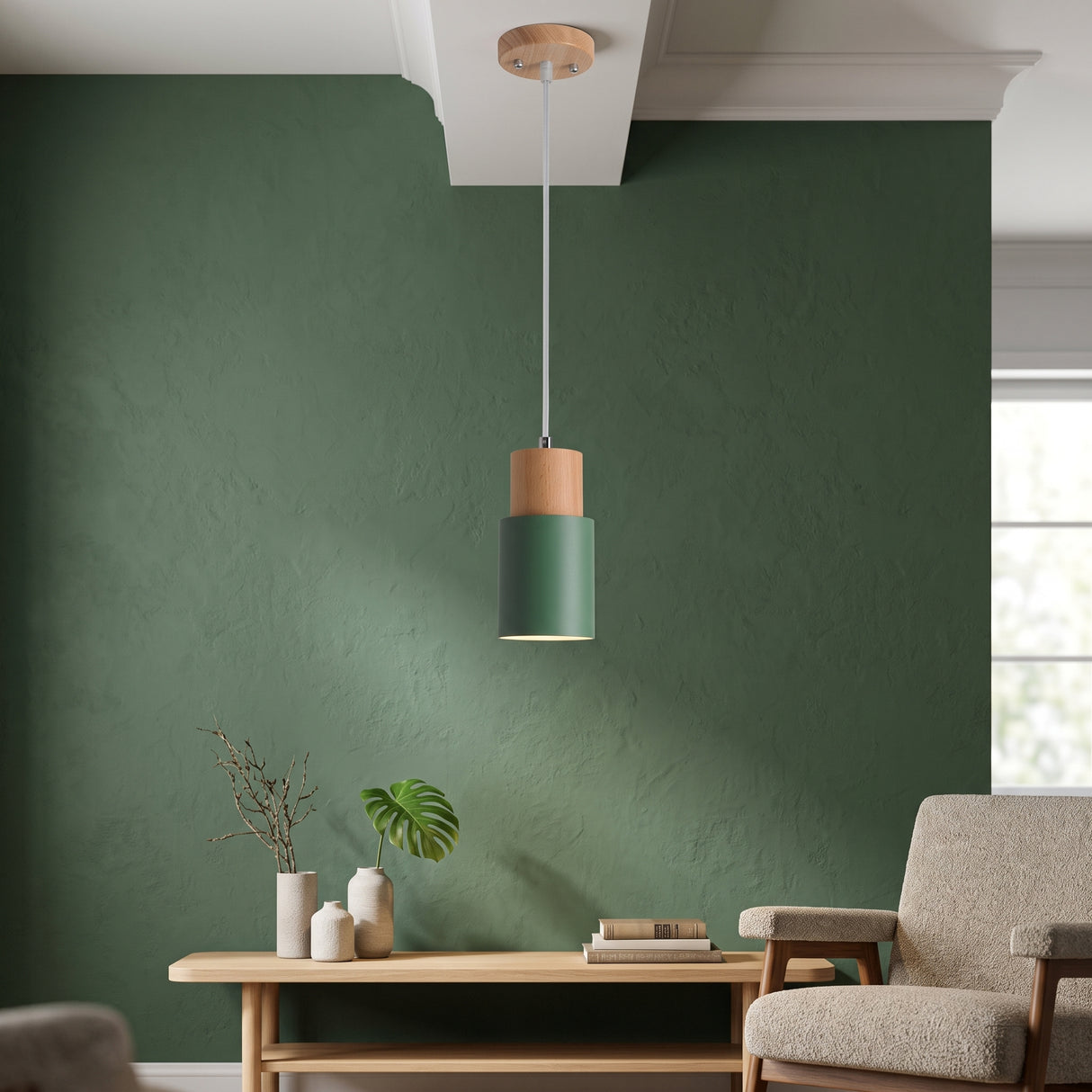 Green cylinder pendant with a wood top over a dining table