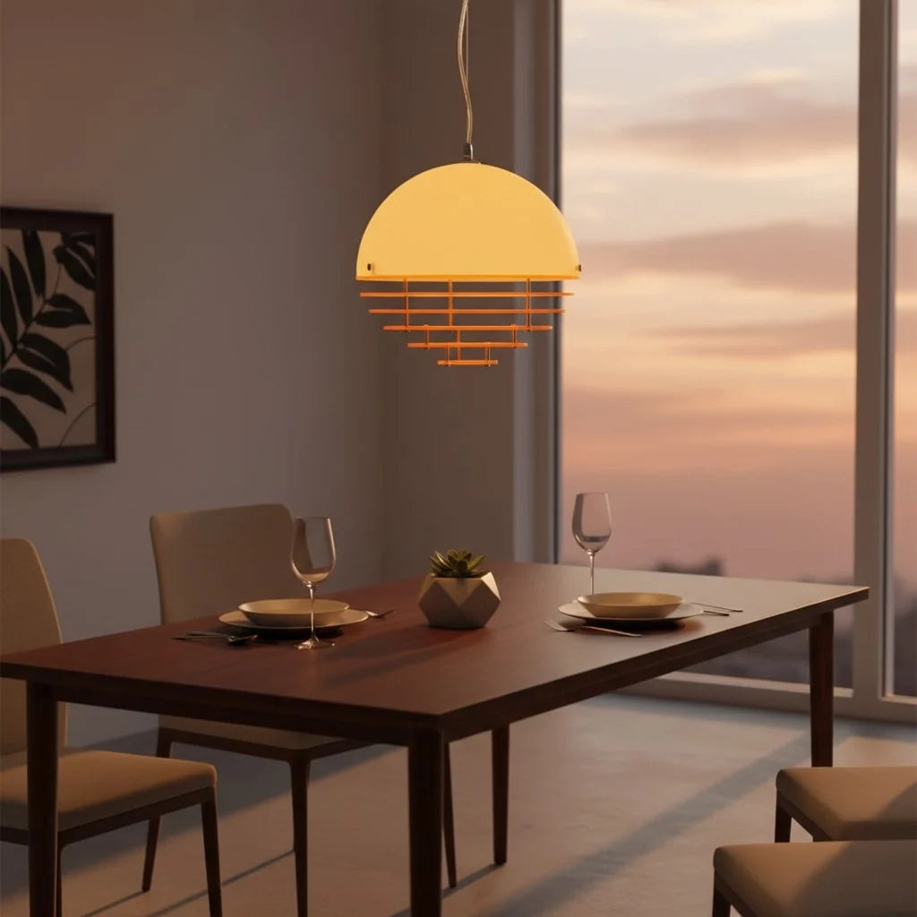 Layered ring pendant lit warm above an interior surface