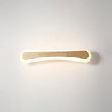 Curved wood and acrylic vanity light shown lit from the front