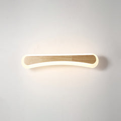 Curved wood and acrylic vanity light shown lit from the front