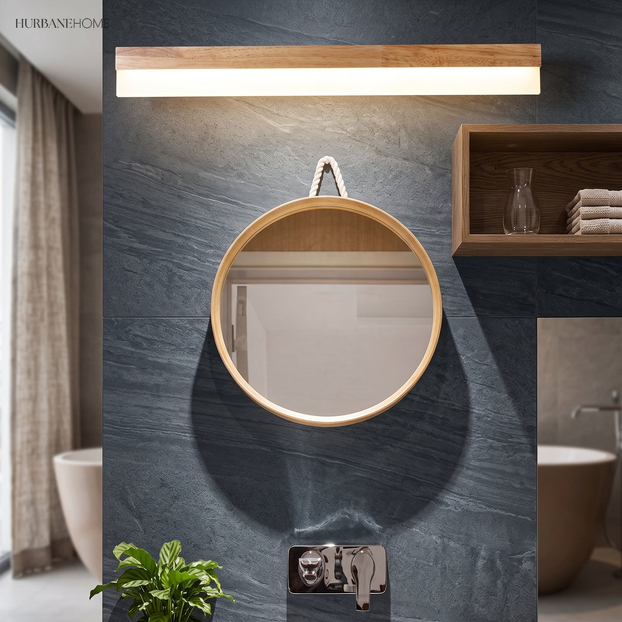 Straight wood vanity light above a round mirror on a slate wall