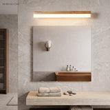 Straight wood vanity light above a square mirror and stone basin