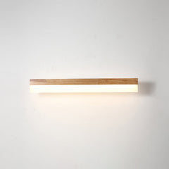 Straight wood and acrylic vanity light shown lit from the front