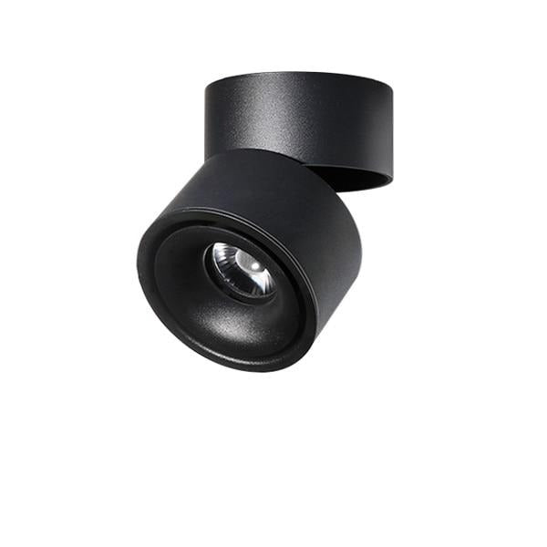 Black rotating ceiling spotlight angled forward on its folding arm