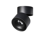 Black rotating ceiling spotlight angled forward on its folding arm