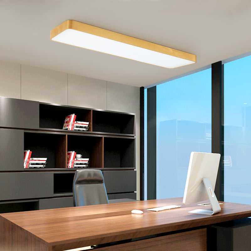 Gold LED ceiling panel lit above an office desk and shelving