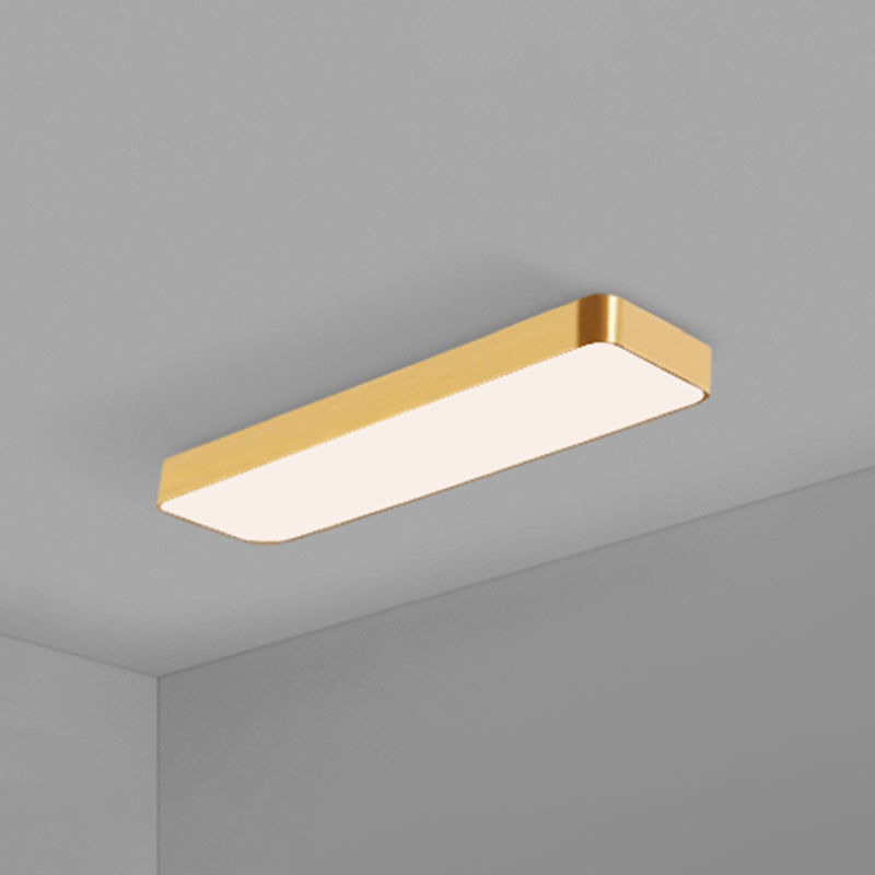 Rectangular gold LED panel sitting flush against a grey ceiling