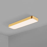 Rectangular gold LED panel sitting flush against a grey ceiling