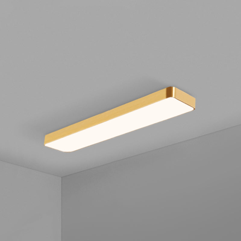 Gold rimmed LED ceiling panel with rounded corners on grey