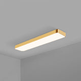 Gold rimmed LED ceiling panel with rounded corners on grey