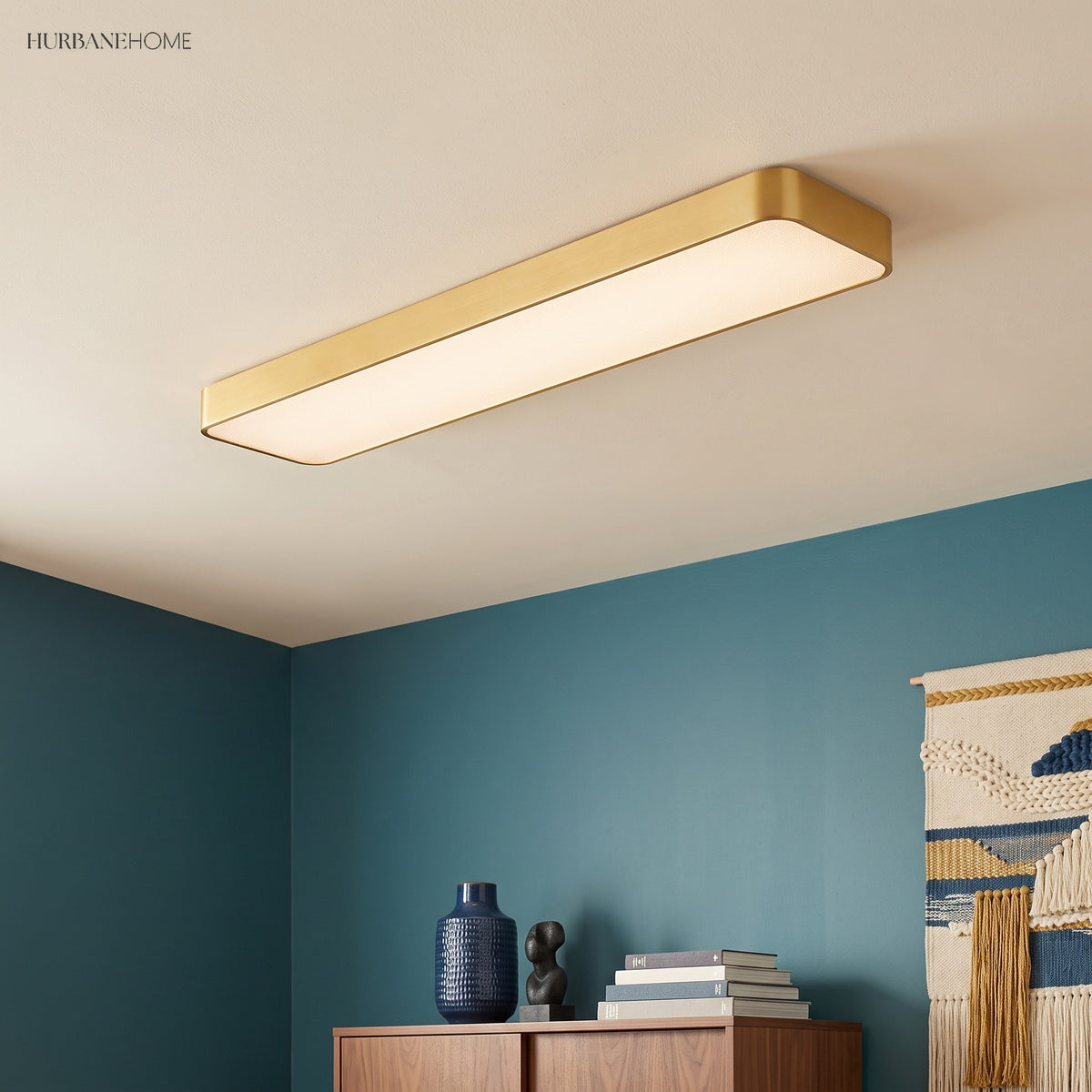 Gold LED ceiling panel fitted to a ceiling in a teal study